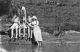 Hildred and her friends on edge of water (1913