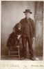 Unknown - Portrait of man with a dog