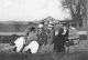 Five Girls Sitting on a Log (Fall 1914)