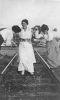 Gertrude Thurow and two other girls on railroad tracks