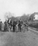 Group bicycling on road (1913)