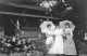 Three Girls with Parasols at old log cabin, Mayo Park, Rochester, MN