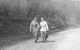 Two Girls Walking on Road